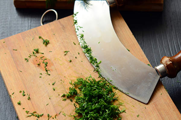Rocker knife and fresh dill.