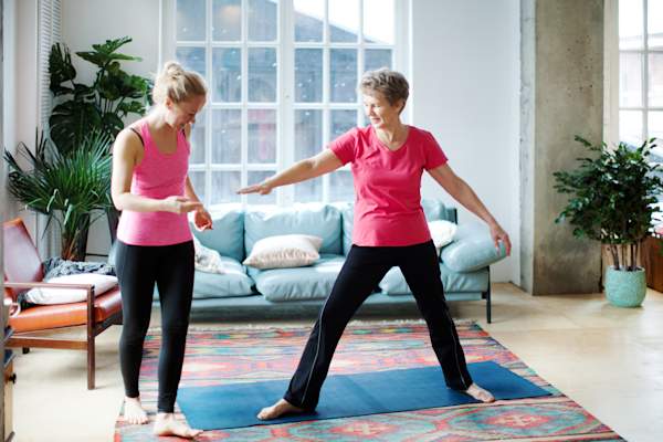 Women exercise at home.