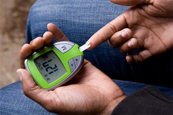 Woman testing her blood sugar.