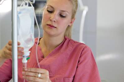 A nurse preparing an infusion.