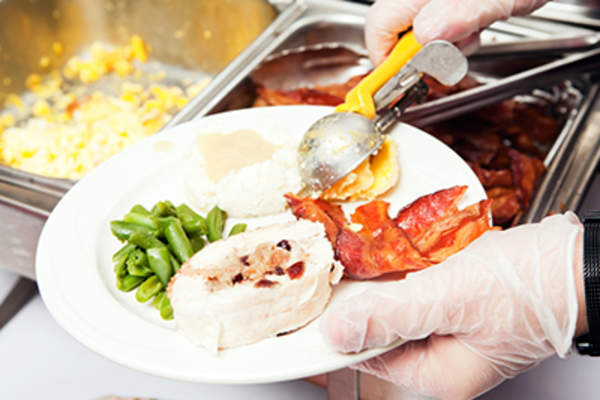 Serving food on a plate.