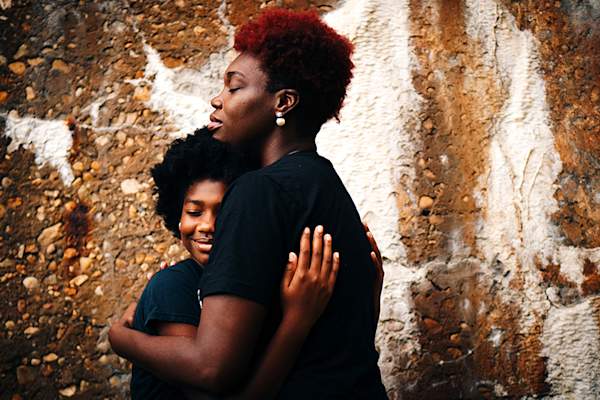 Mother and daughter hugging