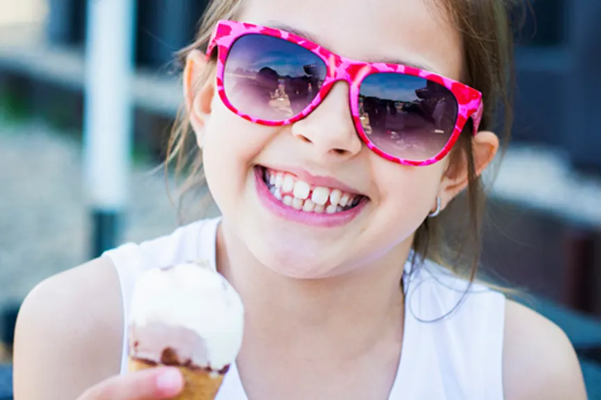 smiling girl with ice cream cone image