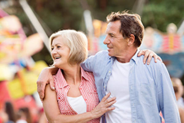 middle aged couple at amusement park image