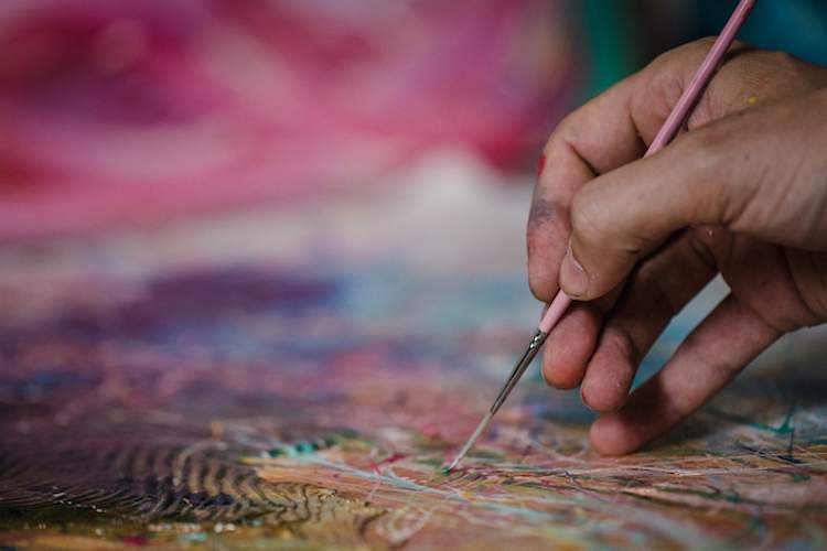 Close up of hand oil painting.