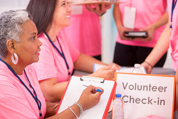 Women volunteers at breast cancer fundraiser.