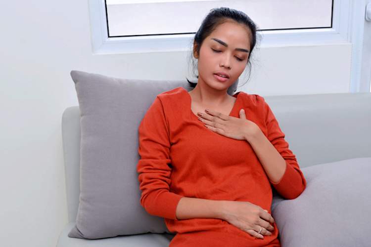 Woman having trouble breathing