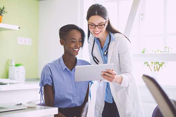 Doctor and patient discussing RA treatment.