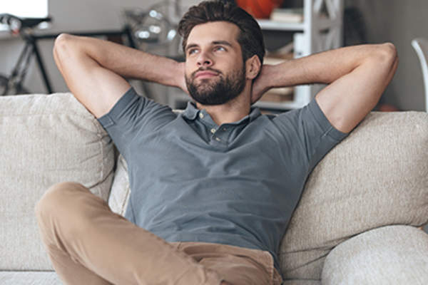 Man relaxing on the couch.