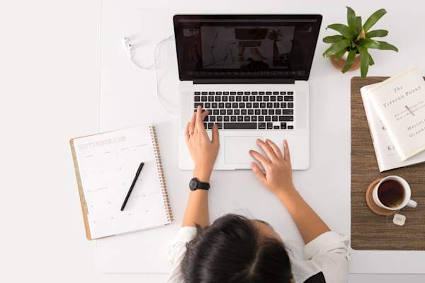 woman typing on computer