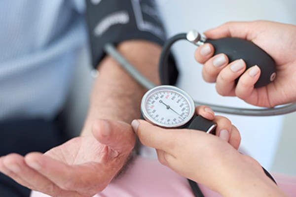 Doctor measuring blood pressure.