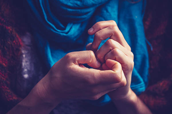 Woman picking her nails.