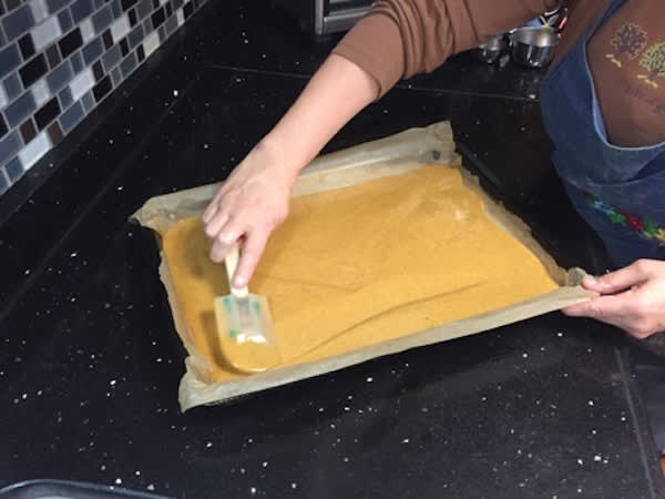 How to Make Gluten-Free Pumpkin Roll-spreading pumpkin batter