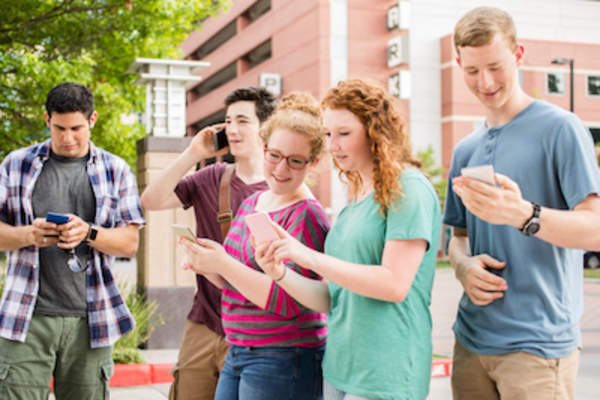 Teens on their phones.