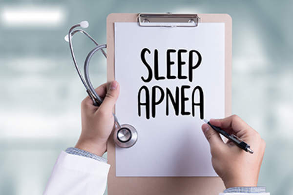 Sleep apnea diagnosis on a doctor clipboard.