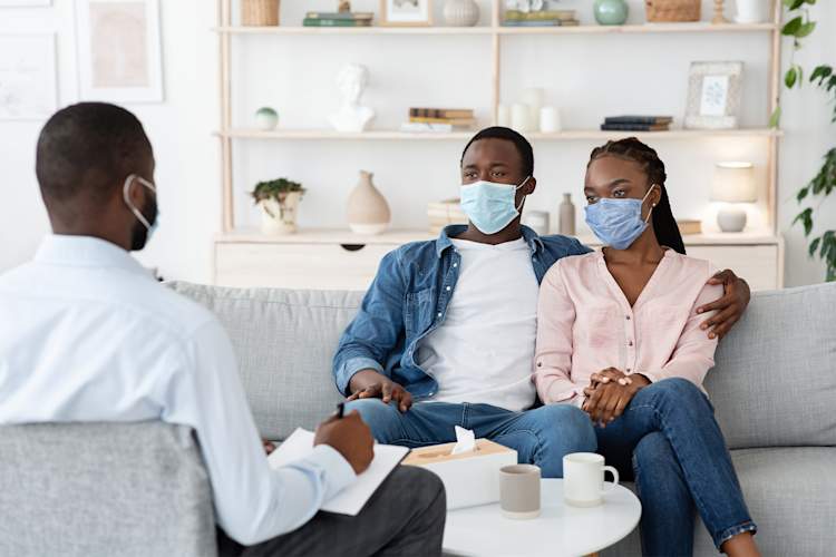 Couple talking with their doctor or therapist.