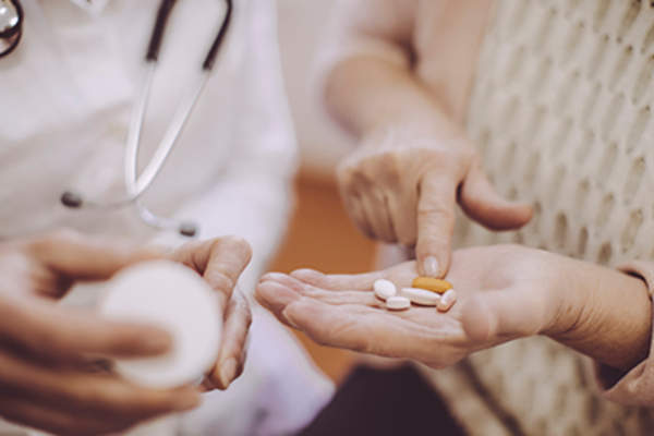 Patient going over medication with a patient.