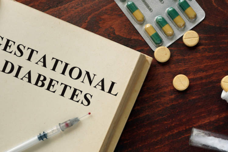 Gestational diabetes in a book surrounded by medicine.