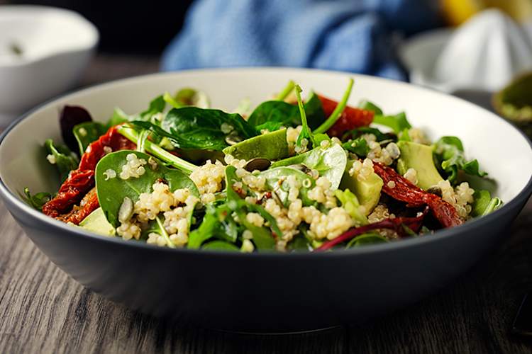 Quinoa salad with avocado and spinach.