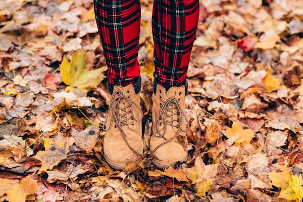 woman in winter boots and plaid pants