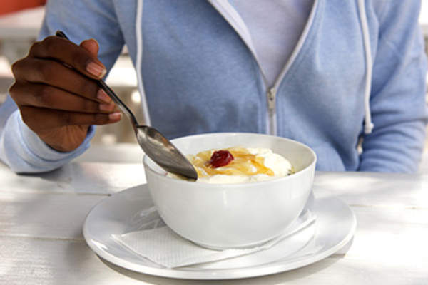 Woman eating dessert.
