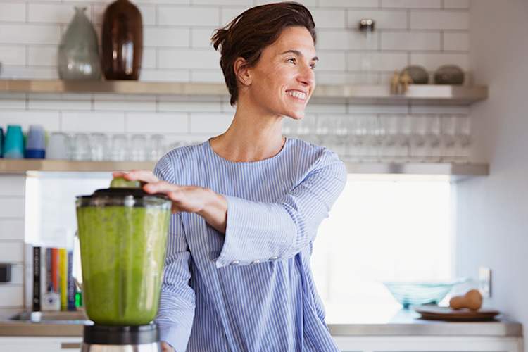 Woman making a smoothie.