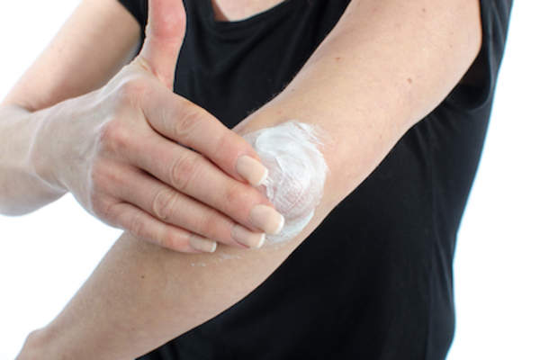 Putting topical cream on elbow even after psoriasis flare is gone.