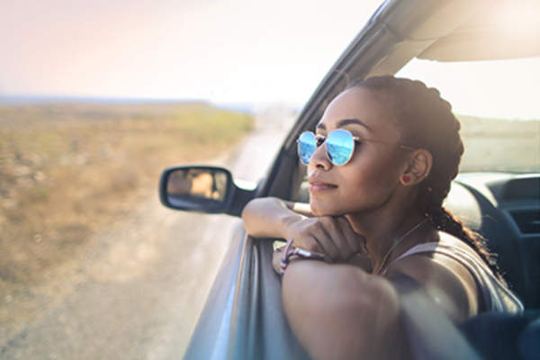 Woman looking out of a car.