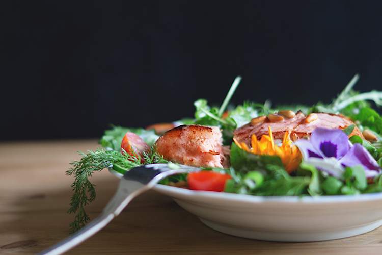 Side-view of salad with salmon
