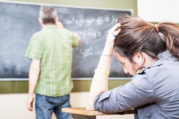 A teacher teaching a lost student.