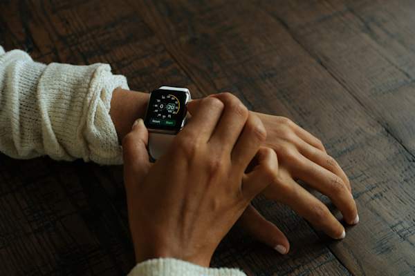 woman looking at wristwatch