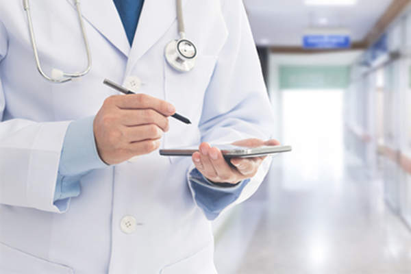 Doctor getting medical information via app on phone.