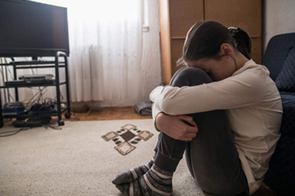 Girl crying in the living room.