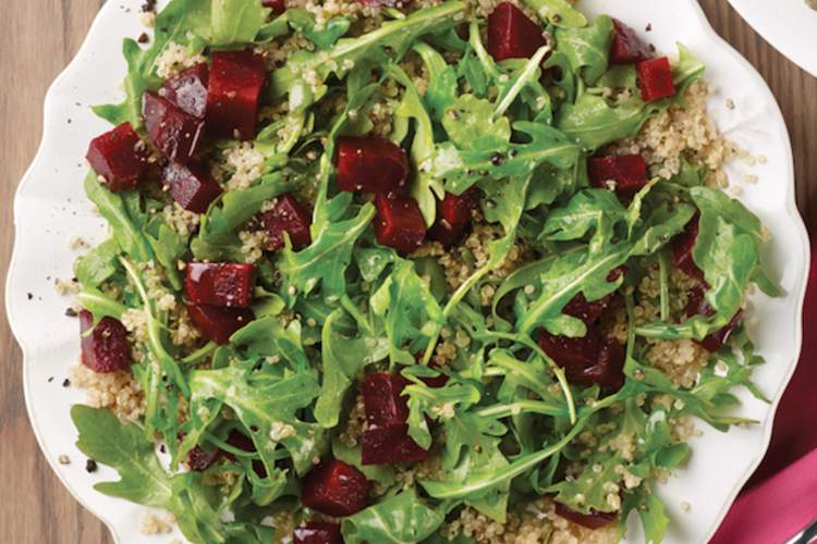 Beet, quinoa, and arugula salad is a balanced meal for a diabetes diet.