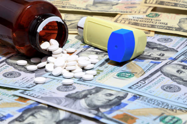 Asthma medication on money.
