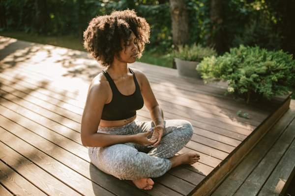 woman meditating outside