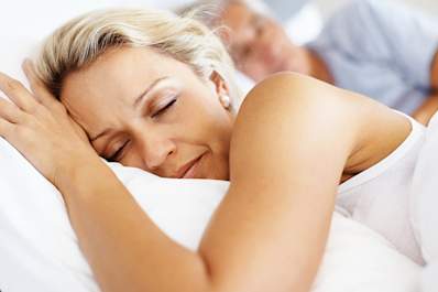 Middle age woman sleeping.
