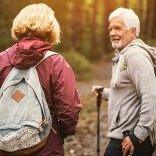 couple hiking in jackets image