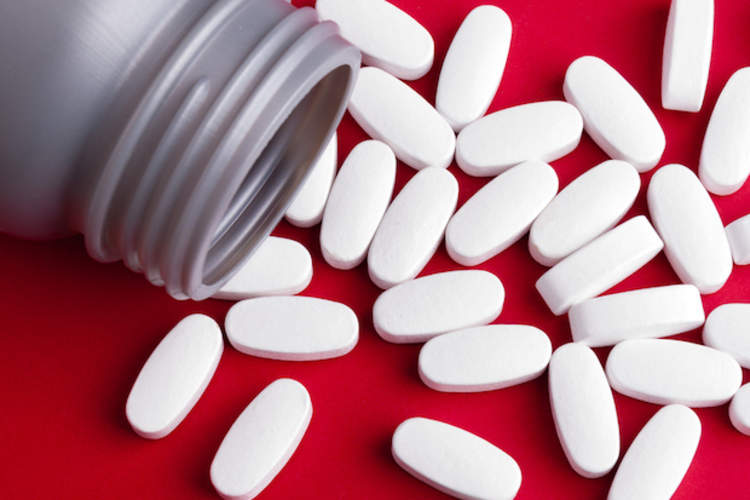 Magnesium supplement pills on a table.