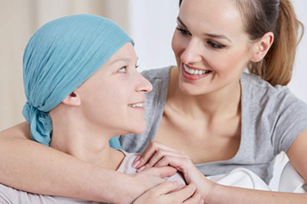 Hopeful cancer woman with friend