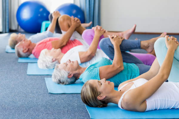 Flexibility exercise, yoga class for seniors.