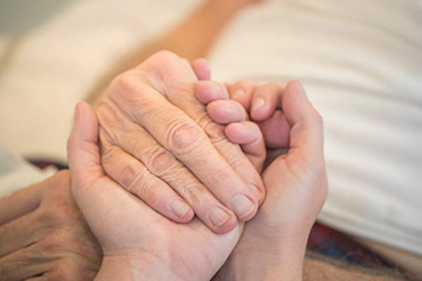 Holding senior hands