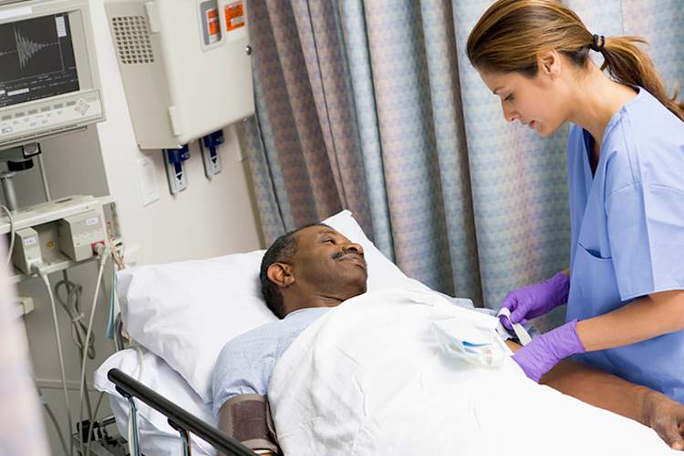 Nurse caring for a patient after surgery.
