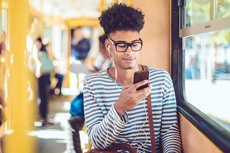 Teenage boy using a smart phone.