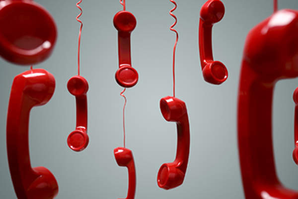 Red telephone receivers.
