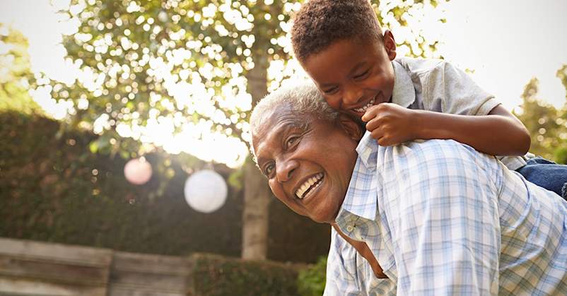 Boy and grandfather playing