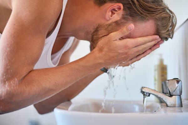 Man washing face.