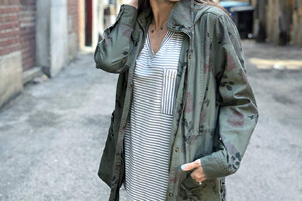 Woman wearing a trench coat.