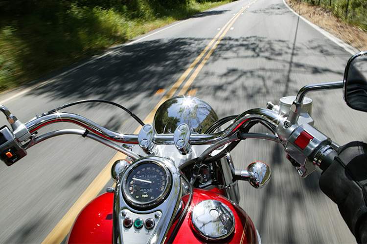 Motorcycle driving on road.