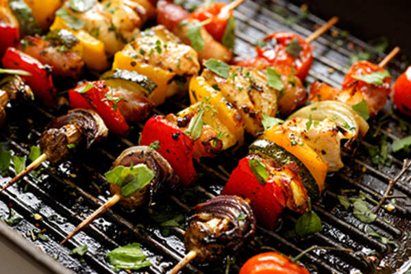 Vegetable and meat skewers in a herb marinade